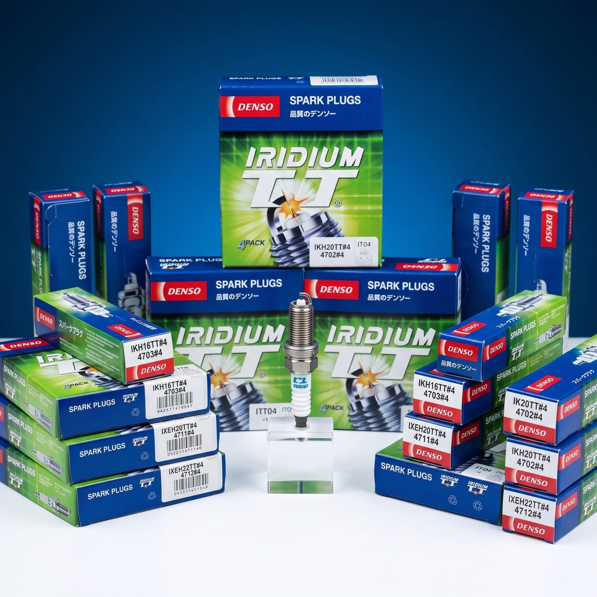 BANQIU Cambodia Co.,Ltd. 出售的 DENSO Iridium TT 高性能汽车火花塞，采用双针技术，包装盒背景清晰可见。